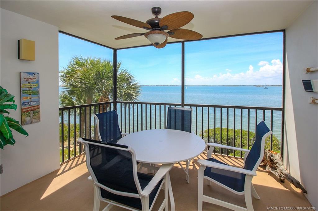 20 Northeast Plantation Road, Unit 205 Jensen Beach, FL 34957 - Photo 1 of 30 a view of a balcony with a table and chairs