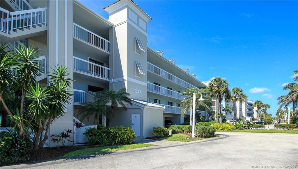 20 Northeast Plantation Road, Unit 205 Jensen Beach, FL 34957 - Photo 2 of 30 a view of a building with a street