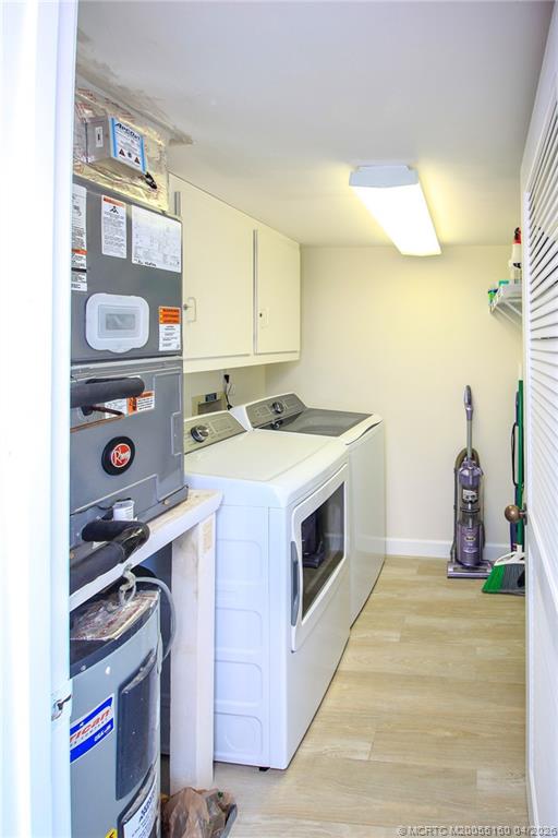 20 Northeast Plantation Road, Unit 205 Jensen Beach, FL 34957 - Photo 25 of 30 a utility room with sink dryer and washer