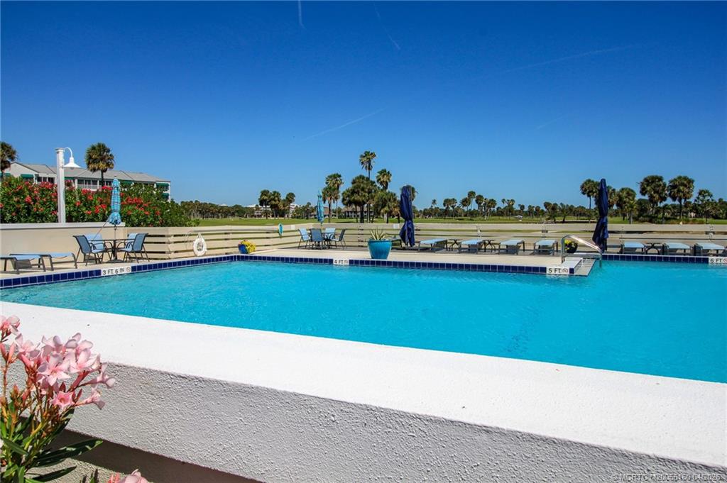 20 Northeast Plantation Road, Unit 205 Jensen Beach, FL 34957 - Photo 26 of 30 a view of a lake with outdoor space