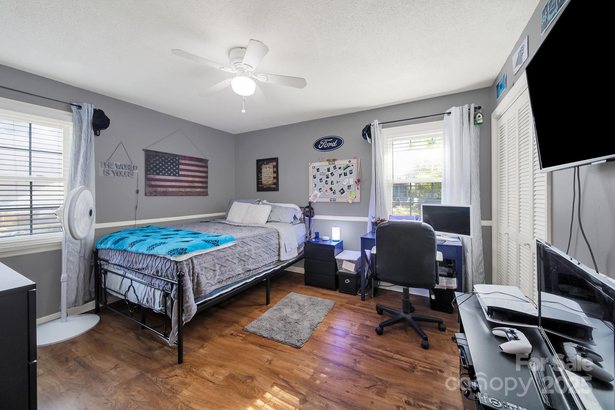 1517 University Drive Lancaster, SC 29720 - Photo 16 of 29 a bedroom with a bed window table chair and a window