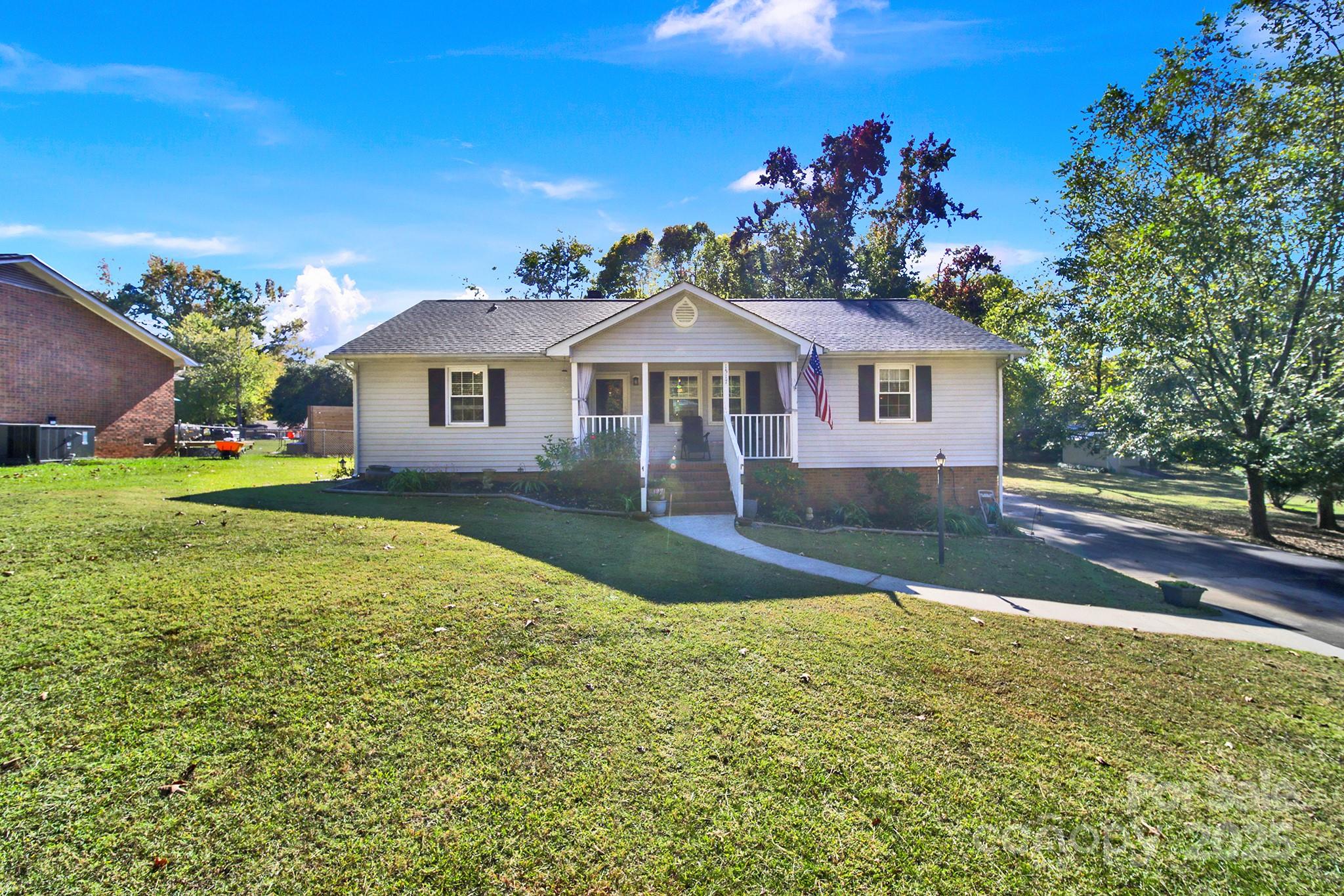 1517 University Drive Lancaster, SC 29720 - Photo 5 of 29 a front view of a house with a garden and yard