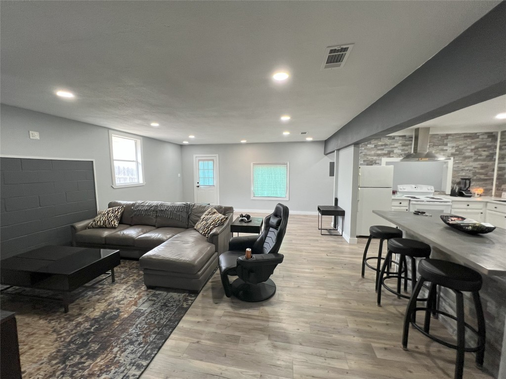 128 Skyview Terrace, Unit B Leander, TX 78641 - Photo 1 of 24 a living room with furniture and wooden floor