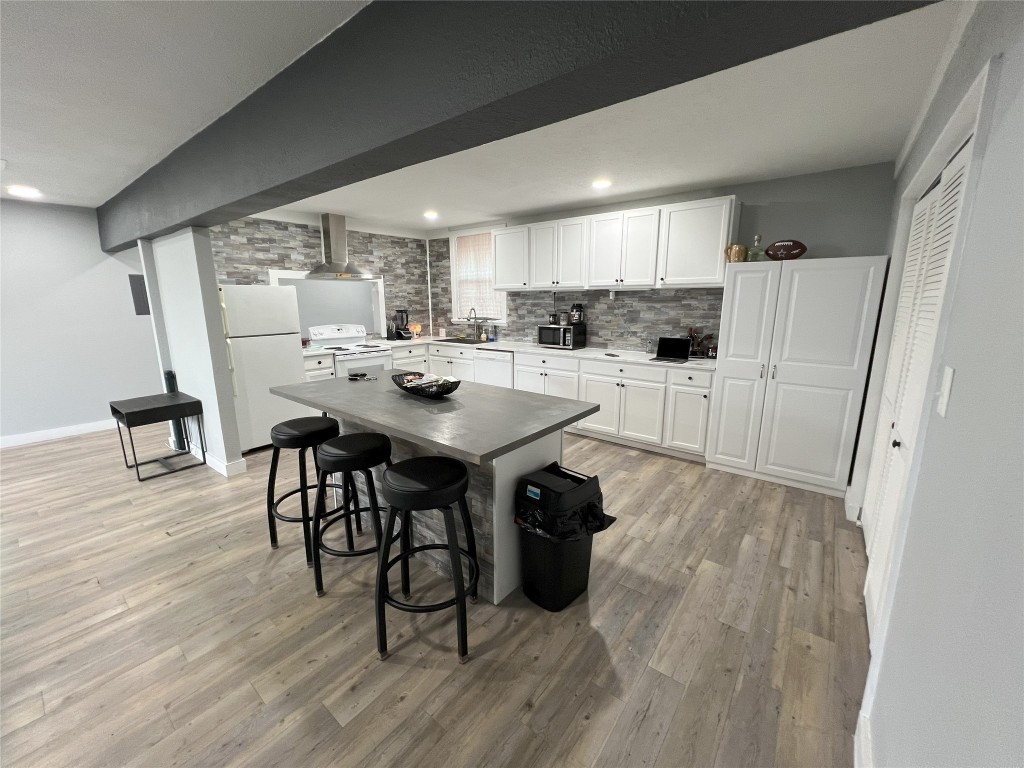 128 Skyview Terrace, Unit B Leander, TX 78641 - Photo 13 of 24 a view of a dining room with furniture and wooden floor