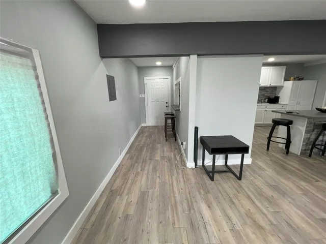 a view of dining room with furniture and wooden floor