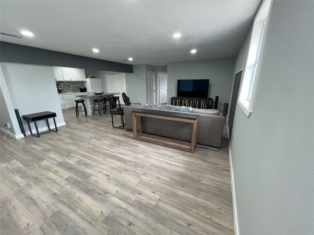 128 Skyview Terrace, Unit B Leander, TX 78641 - Photo 2 of 24 a living room with stainless steel appliances furniture and a flat screen tv