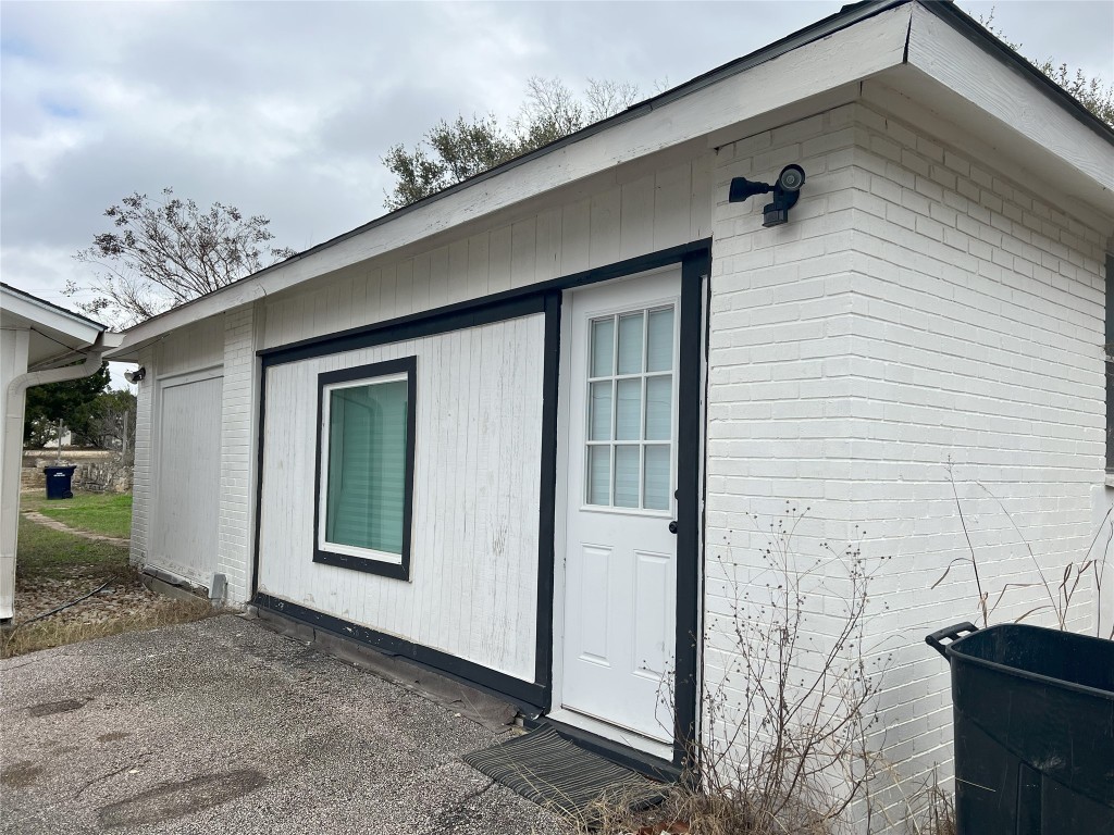 128 Skyview Terrace, Unit B Leander, TX 78641 - Photo 22 of 24 a view of a porch with a bench