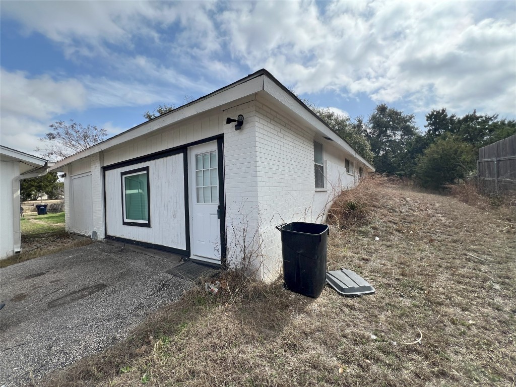 128 Skyview Terrace, Unit B Leander, TX 78641 - Photo 23 of 24 a view of a house with backyard and barbeque grill