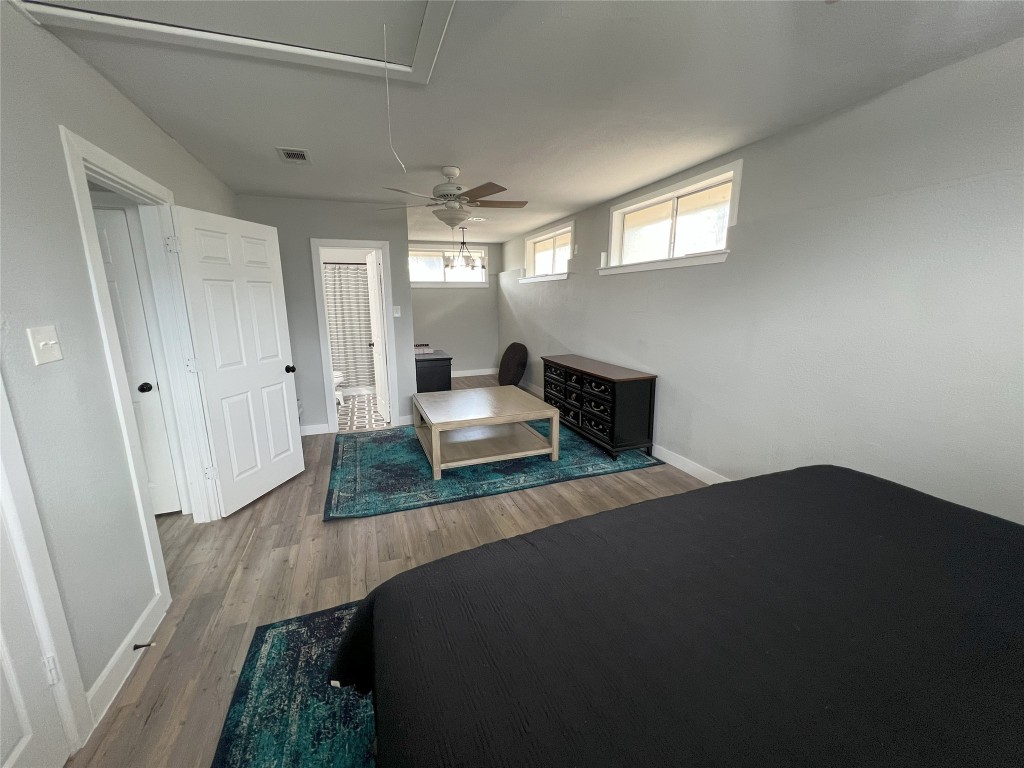 128 Skyview Terrace, Unit B Leander, TX 78641 - Photo 5 of 24 a bedroom with a bed and window