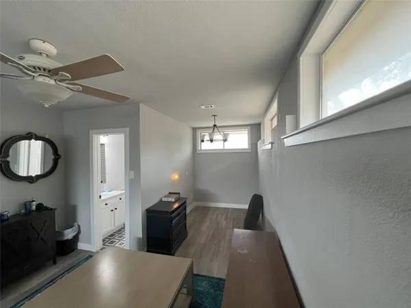 a view of a livingroom with furniture and a window