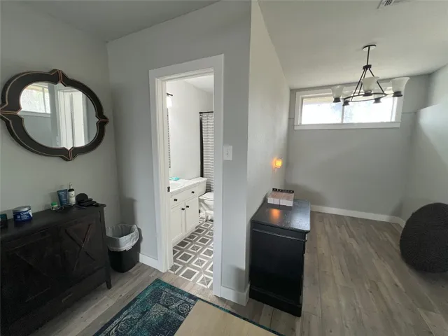 a living room with furniture and a mirror