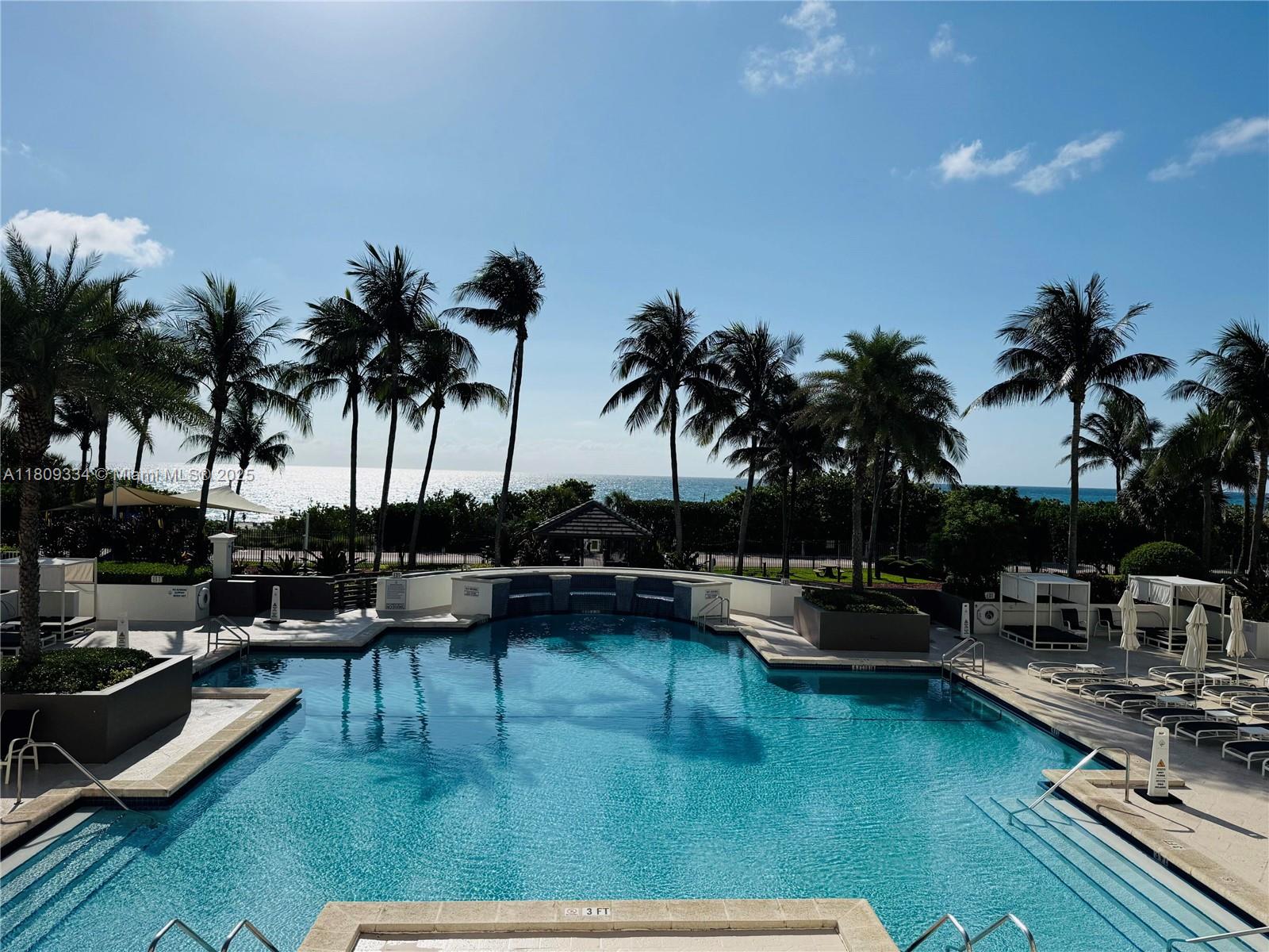 4779 Collins Avenue, Unit 2106 Miami Beach, FL 33140 - Photo 16 of 25 a view of swimming pool with outdoor seating