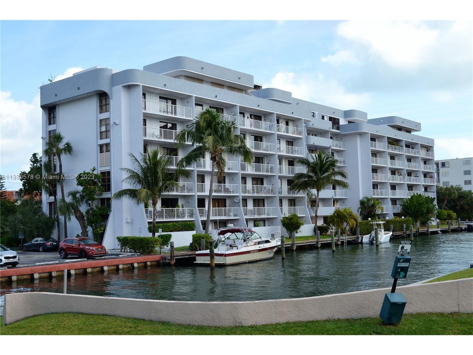 1650 Northeast 115th Street, Unit 102 Miami, FL 33181 - Photo 2 of 35 a view of swimming pool with outdoor seating