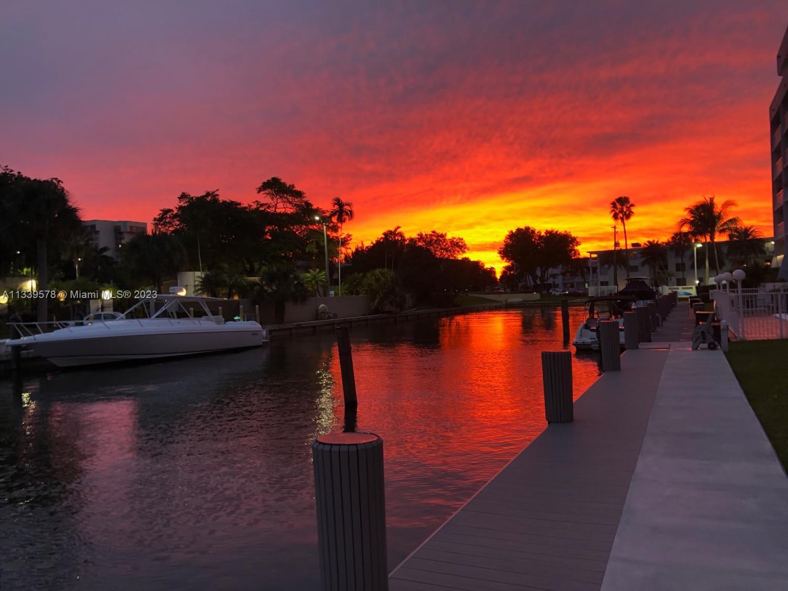 1650 Northeast 115th Street, Unit 102 Miami, FL 33181 - Photo 28 of 35 a view of a lake with a houses