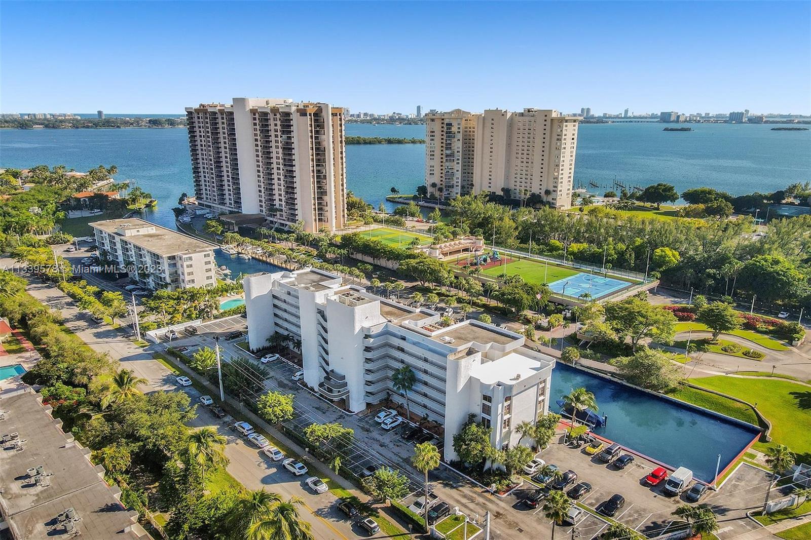 1650 Northeast 115th Street, Unit 102 Miami, FL 33181 - Photo 29 of 35 a view of a city with buildings and ocean view