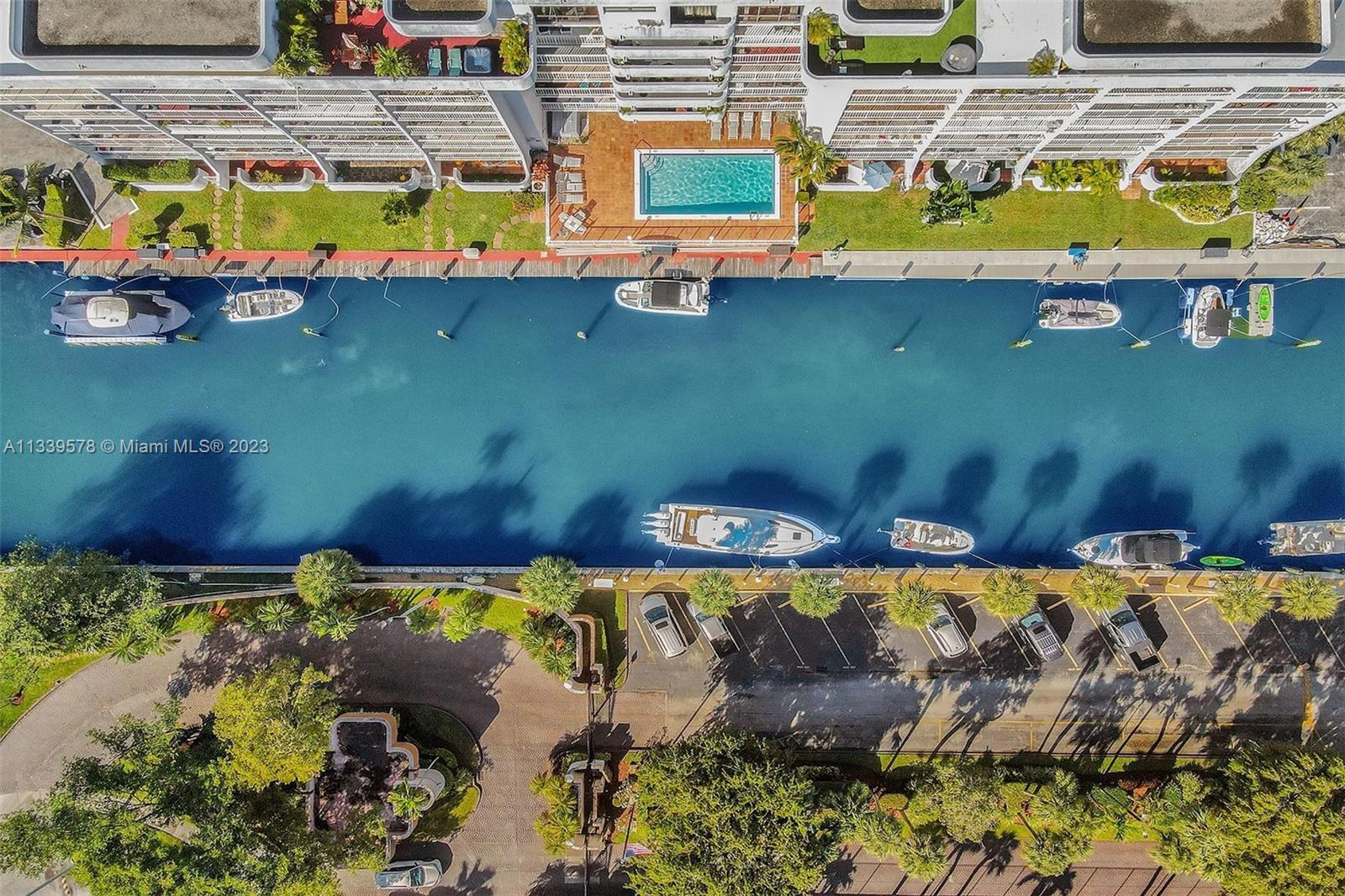 1650 Northeast 115th Street, Unit 102 Miami, FL 33181 - Photo 31 of 35 an aerial view of house with a swimming pool