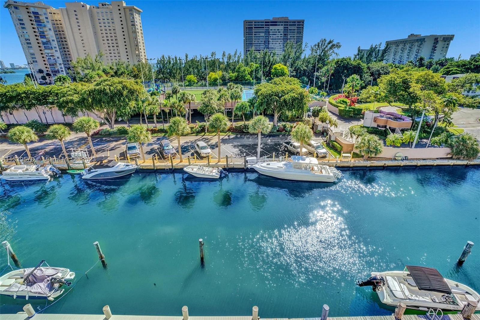 1650 Northeast 115th Street, Unit 102 Miami, FL 33181 - Photo 33 of 35 a view of a lake with sitting area