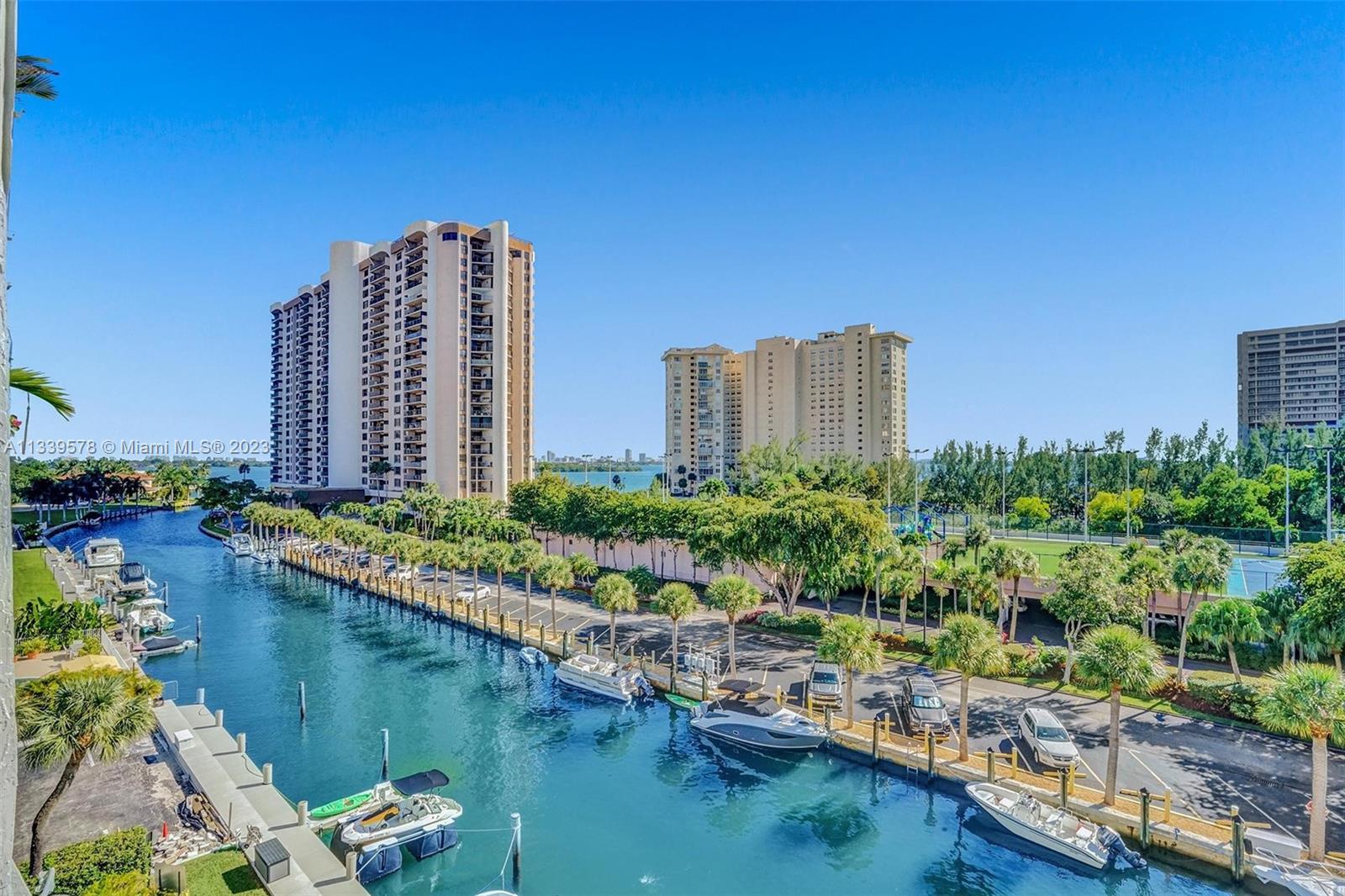 1650 Northeast 115th Street, Unit 102 Miami, FL 33181 - Photo 34 of 35 a view of a lake with a tall buildings in the background