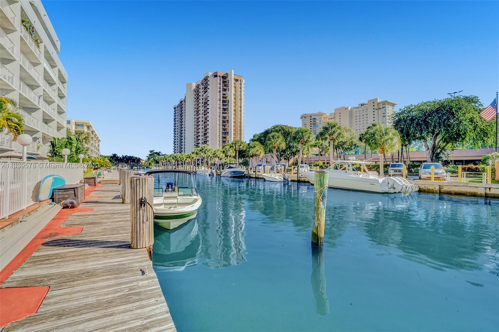 1650 Northeast 115th Street, Unit 102 Miami, FL 33181 - Photo 9 of 35 a view of a lake with tall buildings