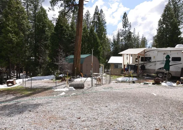 a view of street with parked cars