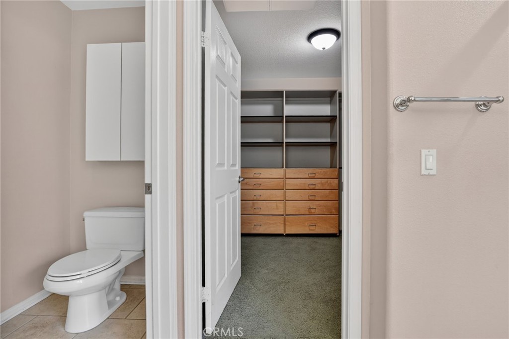 20543 Pesaro Porter Ranch Porter Ranch, CA 91326 - Photo 41 of 67 a bathroom with a toilet and a closet