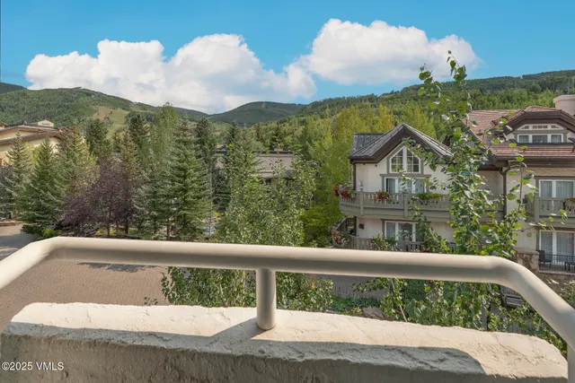 a bedroom with a bed and a night stand