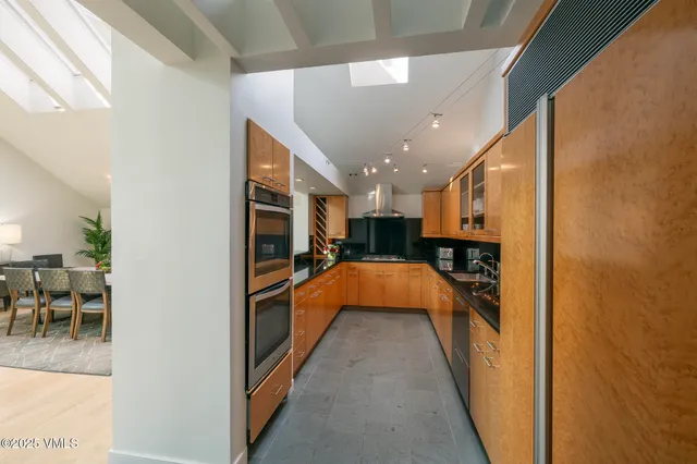 a freezer and a refrigerator in a kitchen