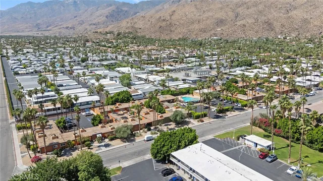 an aerial view of residential house and sandy dunes