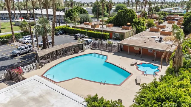 an aerial view of a house with a swimming pool