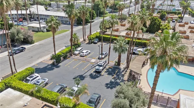 an aerial view of multiple houses with yard