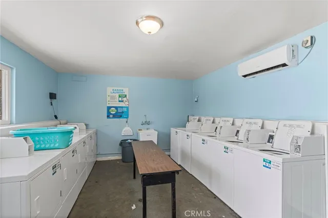 a view of a backyard with wooden fence and large trees