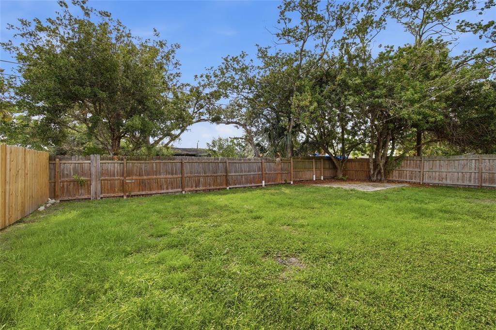 6629 Sierra Terrace New Port Richey, FL 34652 - Photo 21 of 30 a view of yard with grass and trees