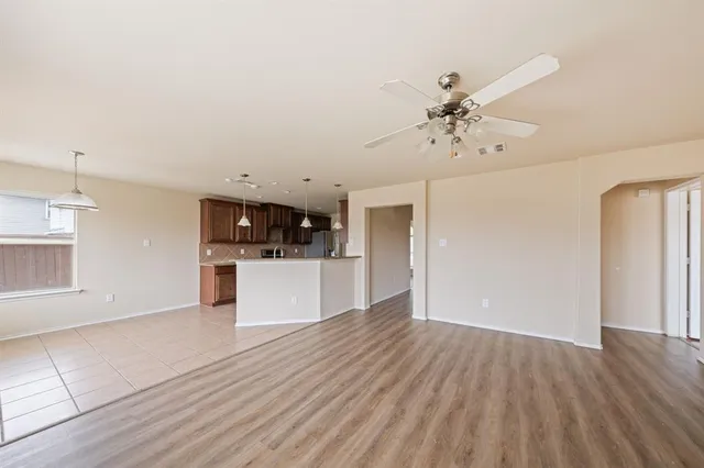 a view of a kitchen with a sink and a stove top oven