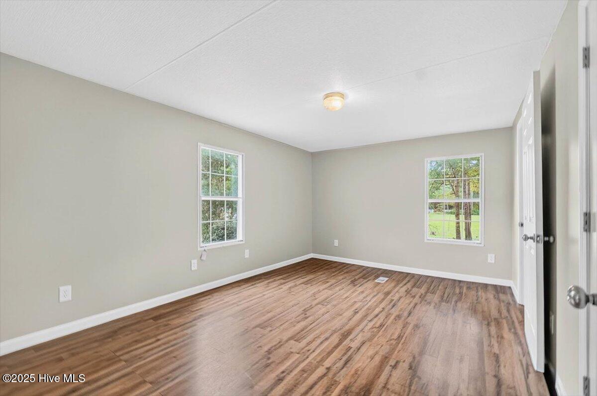 7015 Kingtown Road Northwest Ash, NC 28420 - Photo 18 of 29 Primary Bedroom