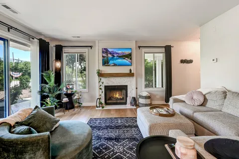 a living room with furniture and a fireplace