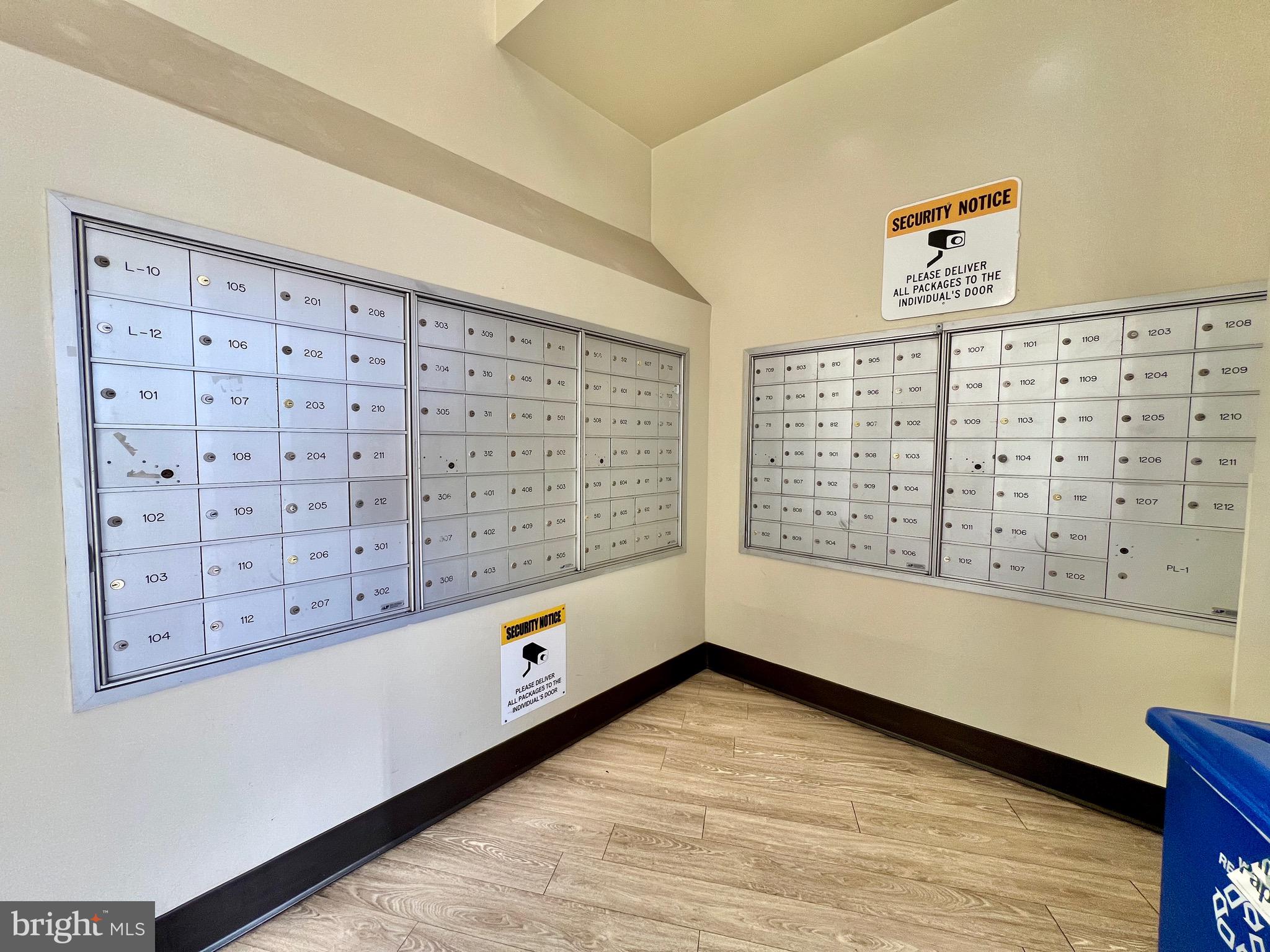 8830 Piney Branch Road, Unit 402 Silver Spring, MD 20903 - Photo 21 of 23 a view of an empty room with wooden floor and a window