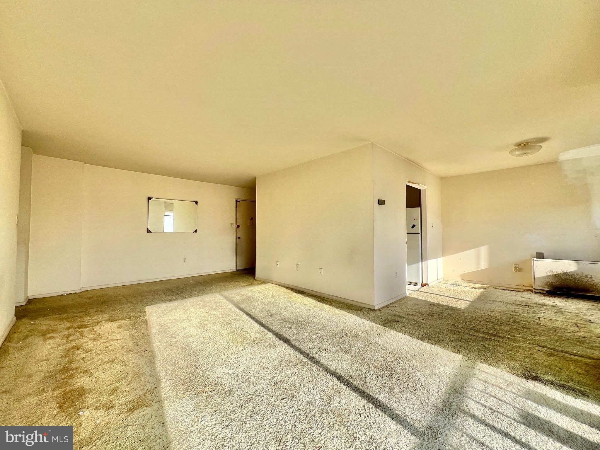 8830 Piney Branch Road, Unit 402 Silver Spring, MD 20903 - Photo 3 of 23 a view of a livingroom with wooden floor