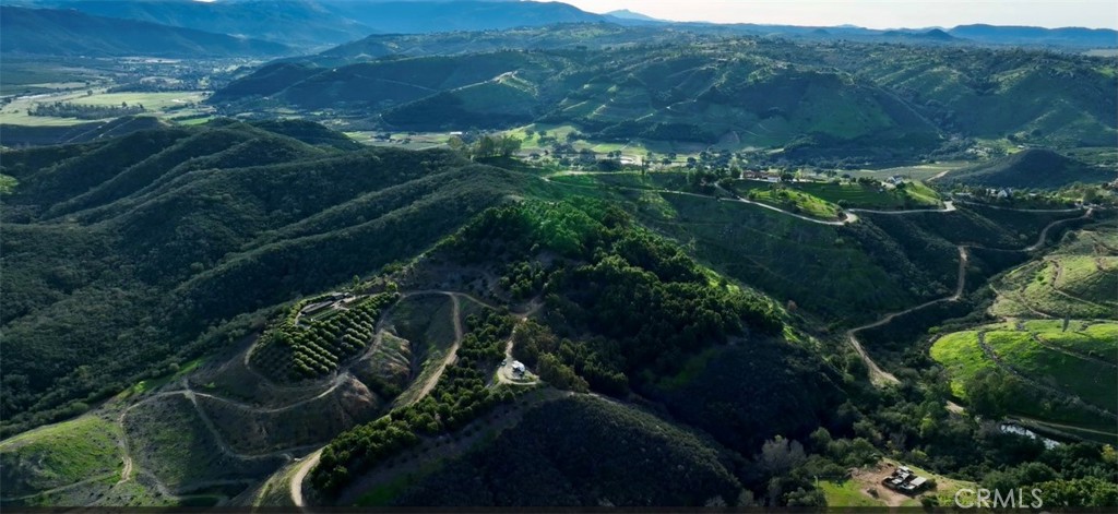 26915 Muutama Road Valley Center, CA 92082 - Photo 30 of 40 a view of a garden with plants and large trees