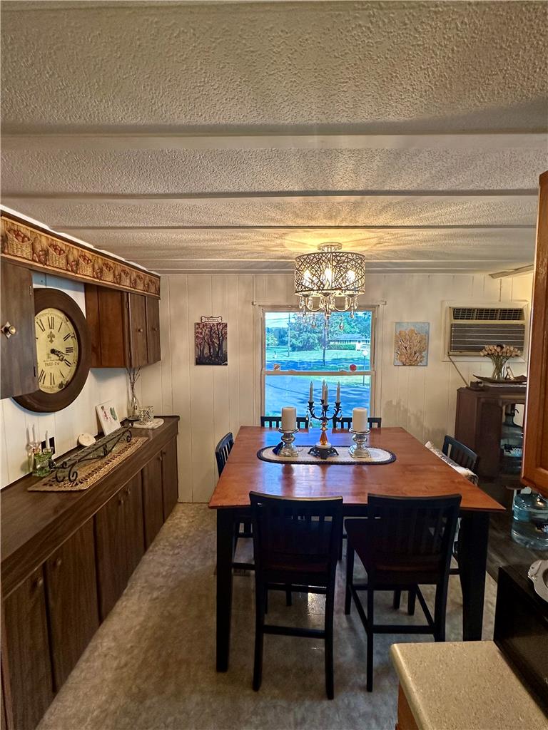 381 Red Oak Lane Bath, PA 18014 - Photo 11 of 27 Illuminated by a contemporary chandelier, this dining area provides a charming space for meals.