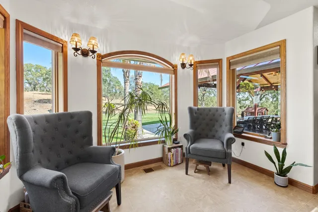 a spacious bathroom with a tub sink and mirror