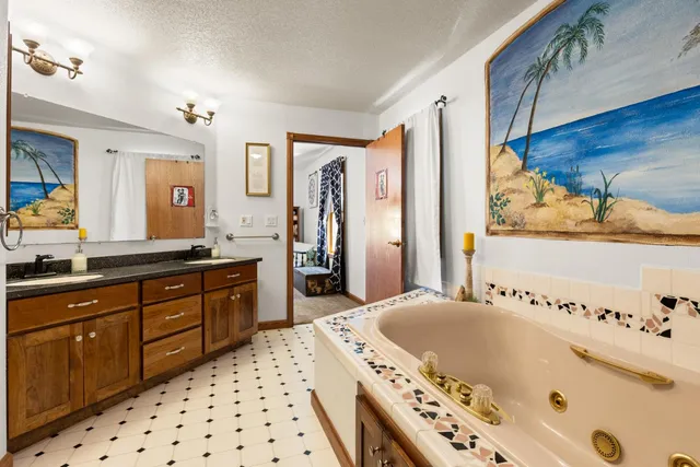 a bedroom with a bed and a table in it