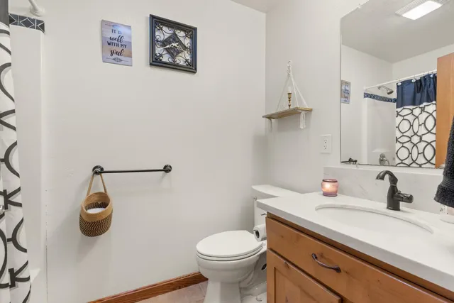 a view of a house with a yard and garage