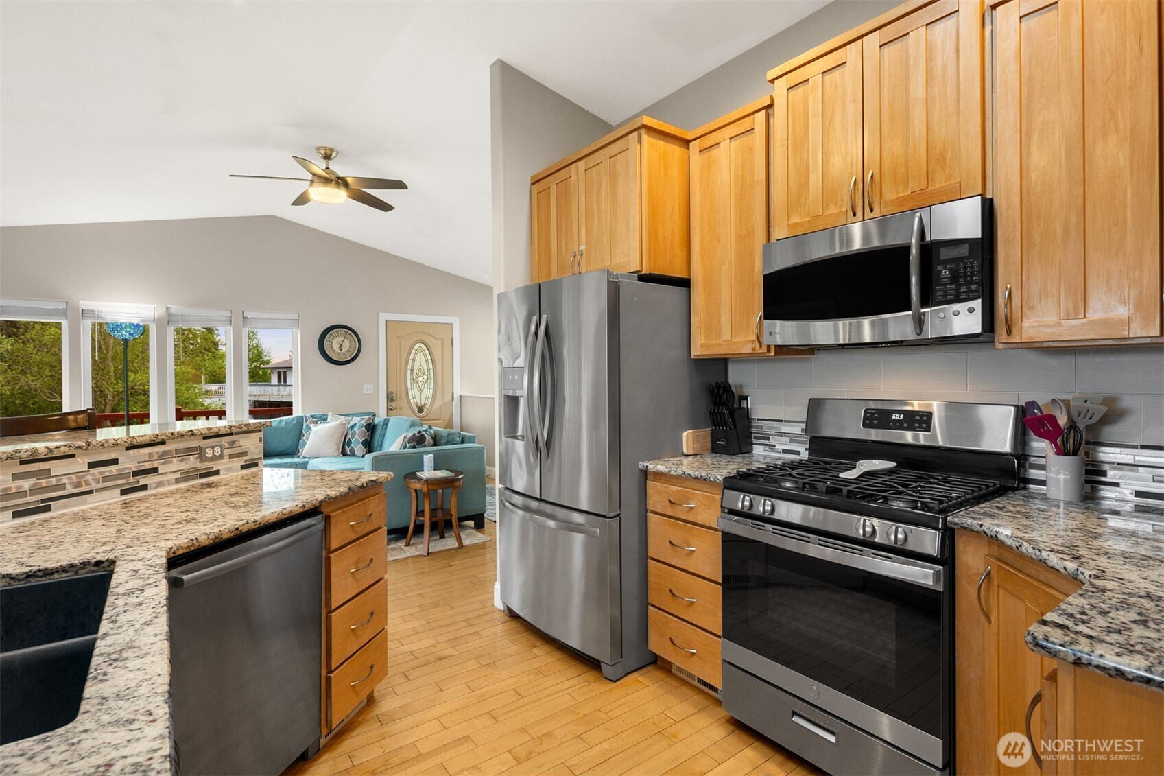 1409 Commodore Place Freeland, WA 98249 - Photo 14 of 38 a kitchen with a stove a sink and a refrigerator