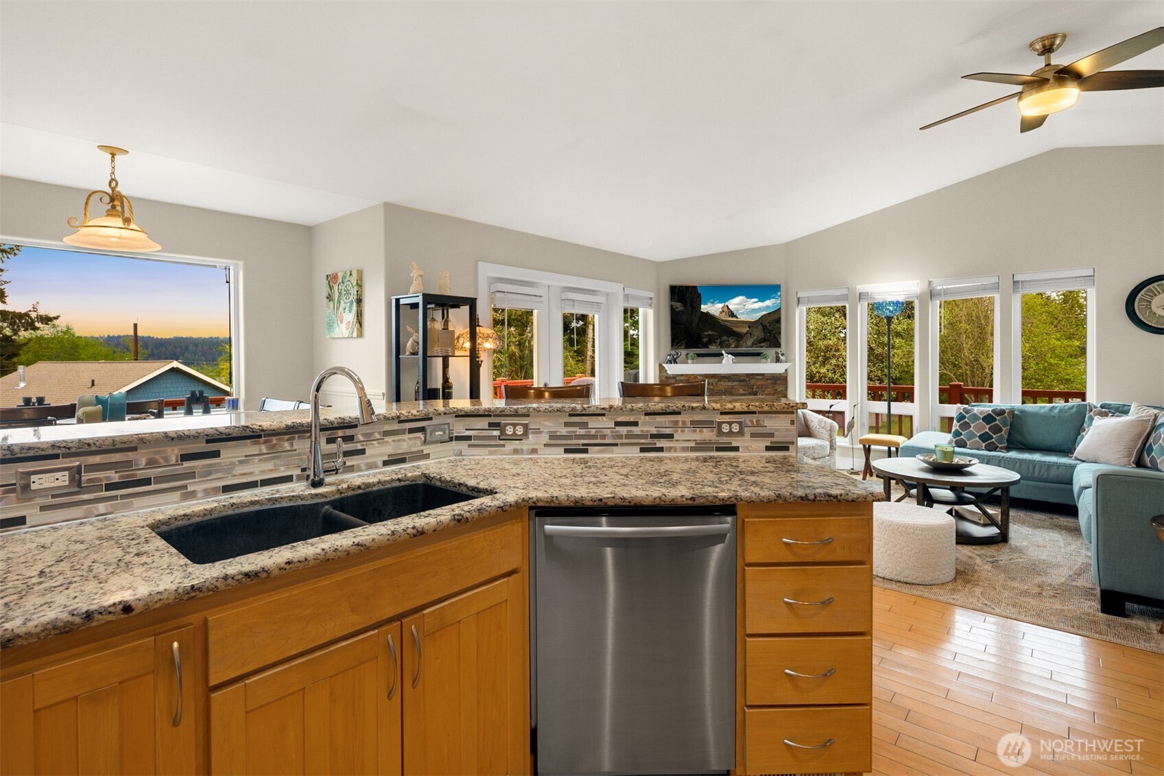1409 Commodore Place Freeland, WA 98249 - Photo 15 of 38 a kitchen with a sink and a stove with a living room