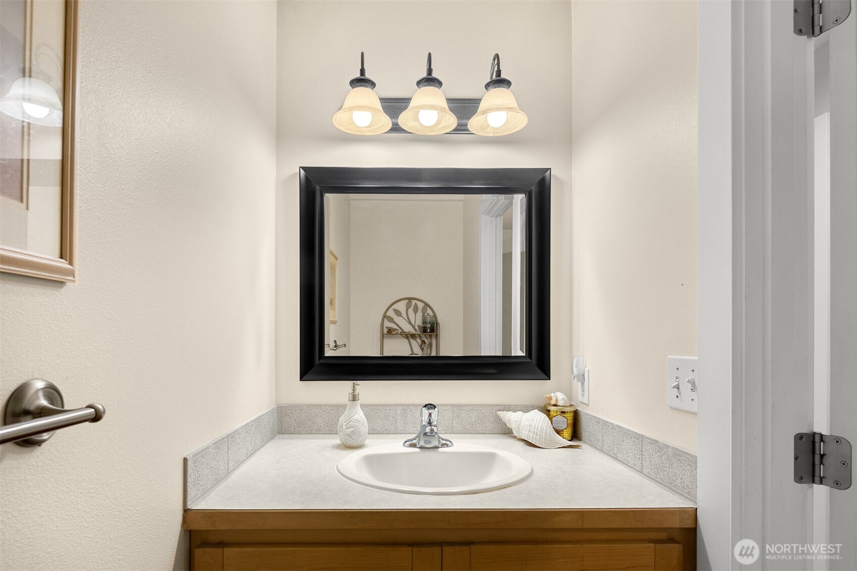 1409 Commodore Place Freeland, WA 98249 - Photo 29 of 38 a bathroom with a sink and a mirror