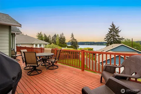 a view of a roof deck with furniture