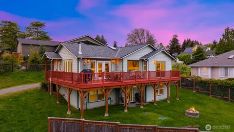 a front view of a house with yard and porch