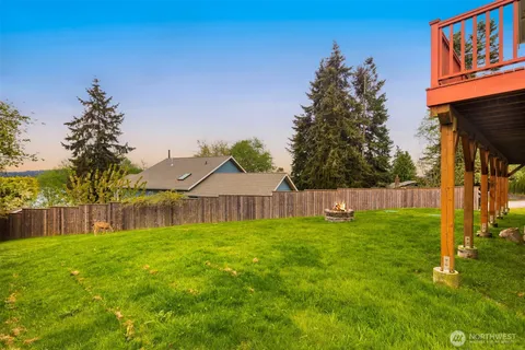 a view of a backyard with a small cabin