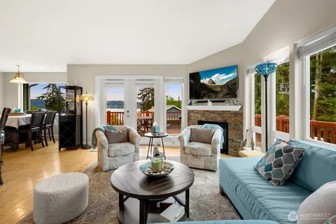a living room with fireplace furniture and a flat screen tv