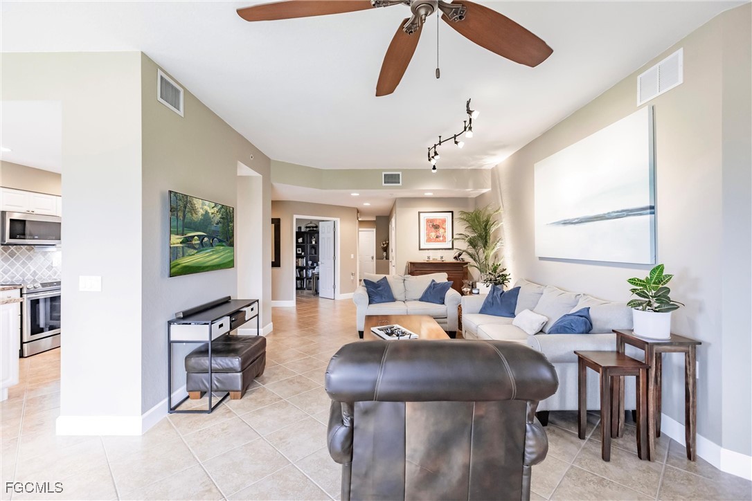 13120 Pebblebrook Point Circle, Unit 102 Fort Myers, FL 33905 - Photo 13 of 50 a living room with furniture and a window